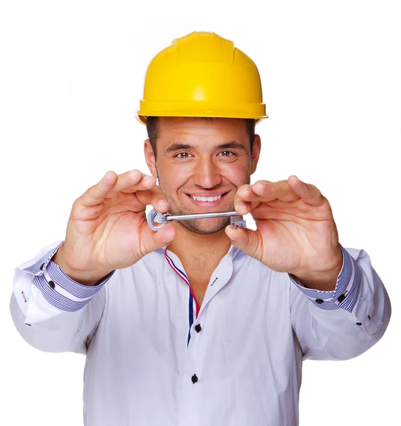 Retrato de trabajador sexy posando en estudio con llave — Foto de Stock