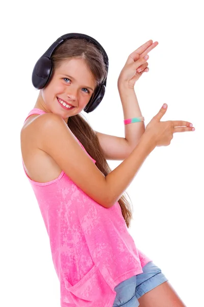 Portrait of young girl listening to music in studio — Stock Photo, Image