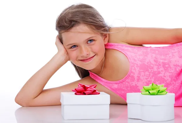 Portrait of young girl posing in studio with white box — Stock Photo, Image