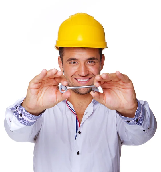 Retrato de trabalhador sexy posando em estúdio com chave — Fotografia de Stock