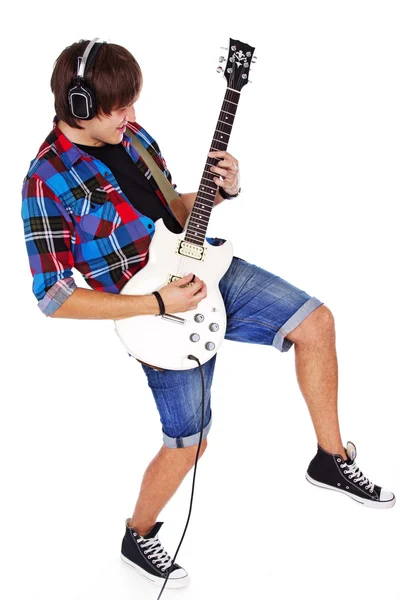 Portrait of young rocker posing in studio on white background — Stock Photo, Image