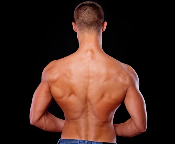 A photo of an athletic man shot from the back — Stock Photo, Image