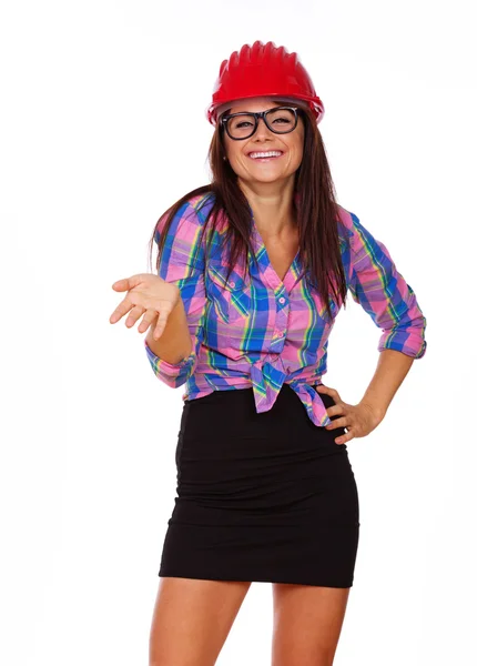 A girl in glasses is wearing a hard hat — Stock Photo, Image