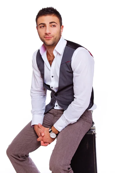 A mature man is sitting on a bag — Stock Photo, Image