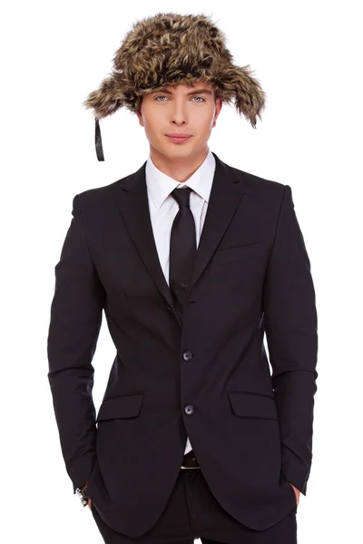 A man wearing a black suit and a fur hat — Stock Photo, Image