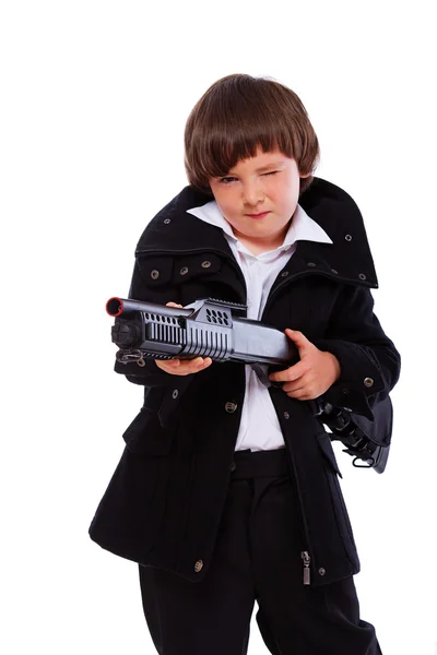 Retrato de chico guapo posando en estudio con pistola — Foto de Stock