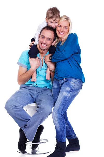 Portrait of smiling family posing in studio on white background — Stock Photo, Image