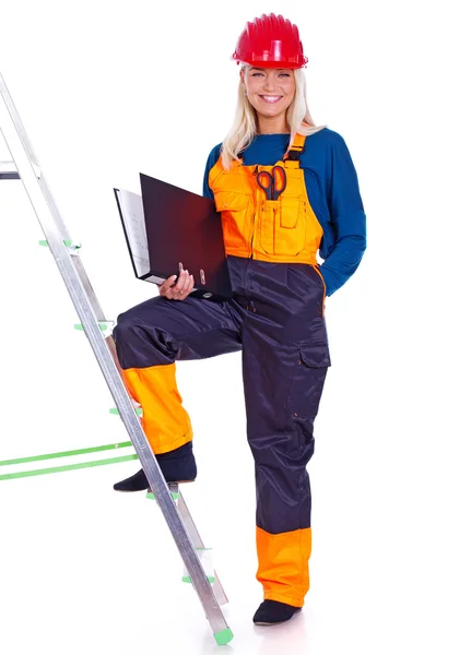 Portrait of beautiful girl posing on white background on ladder — Stock Photo, Image