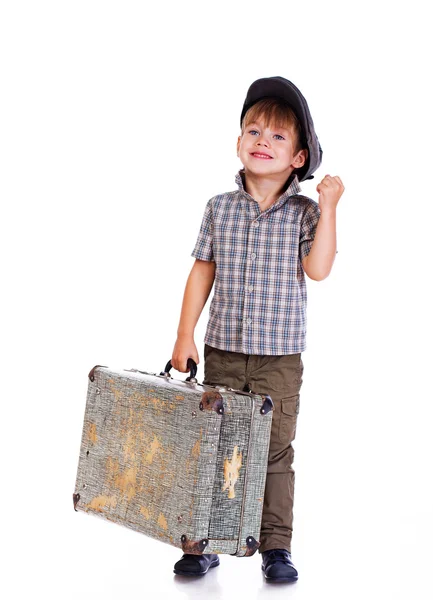 Portret van kleine jongen die zich voordeed op witte achtergrond met zak — Stockfoto