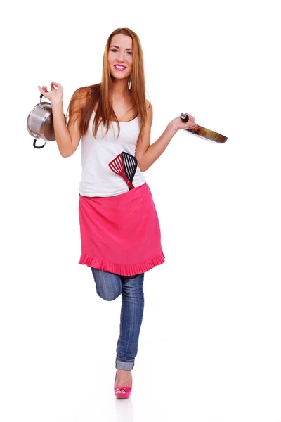 Retrato de menina bonita posando no fundo branco na cozinha — Fotografia de Stock