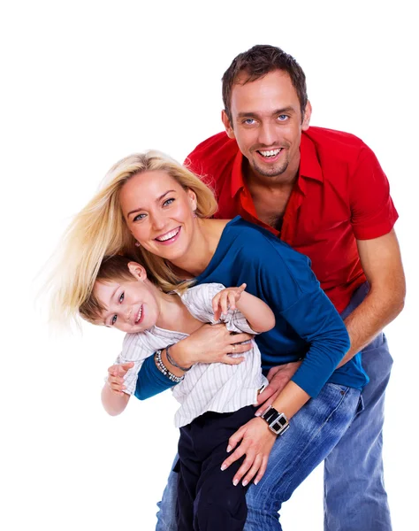 Retrato de família sorridente posando em estúdio sobre fundo branco — Fotografia de Stock