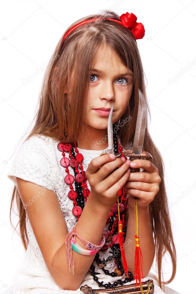 Portrait of beautiful girl posing on white background with knife