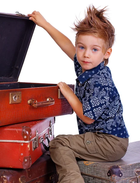 Portrait of handsome kid posing on white background with bag Stock Image