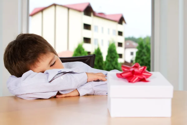 Portrait of young kid posing at home with present — Stock Photo, Image