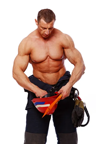 Retrato de bombeiro bonito posando no fundo branco — Fotografia de Stock