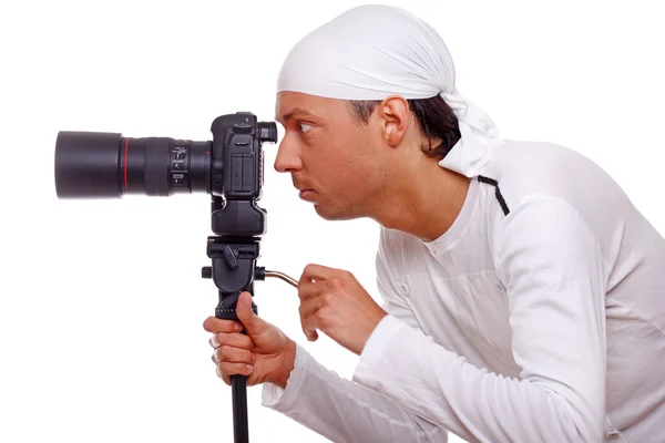 Portrait of handsome man posing on white background with camera — Stock Photo, Image