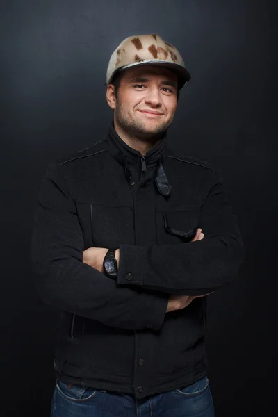 Portrait of handsome man posing on black background — Stock Photo, Image