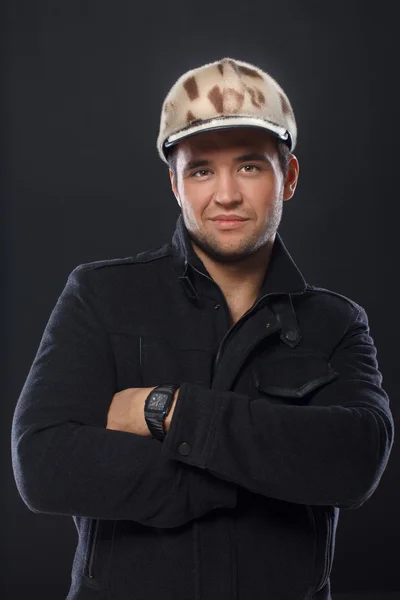 Portrait of handsome man posing on black background — Stock Photo, Image