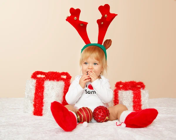 Portrait of young child posing on beige background — Stock Photo, Image