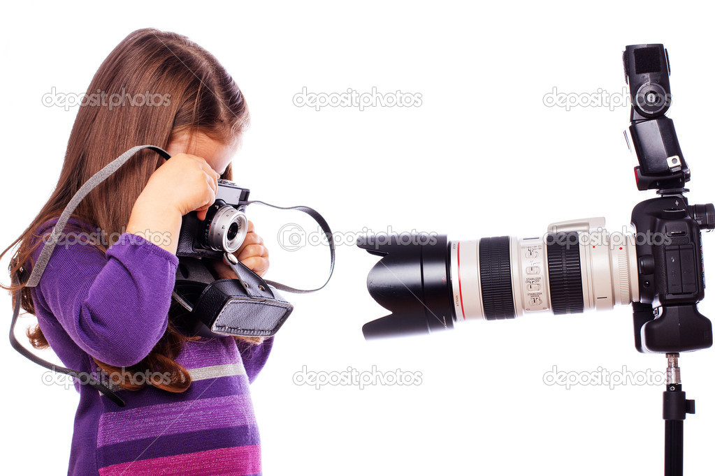 A little girl is taking pictures