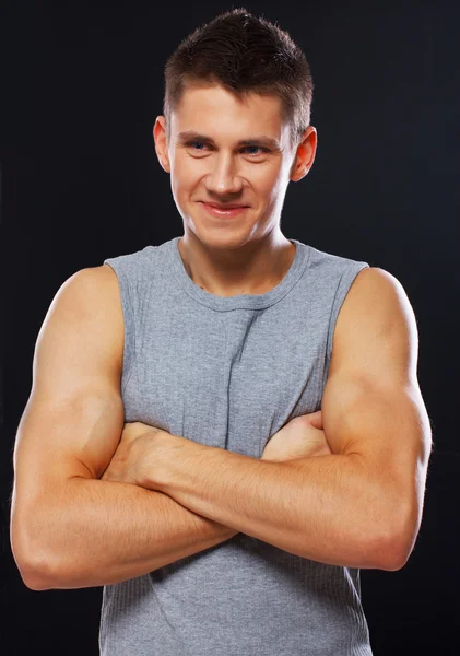 Portrait of handsome man posing on black background — Stock Photo, Image