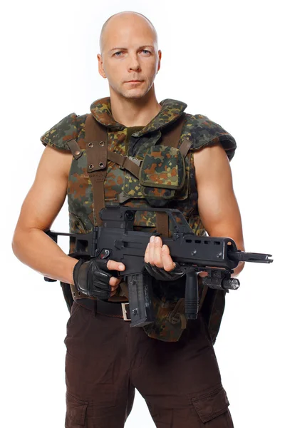 Man is posing on the floor with a gun — Stock Photo, Image