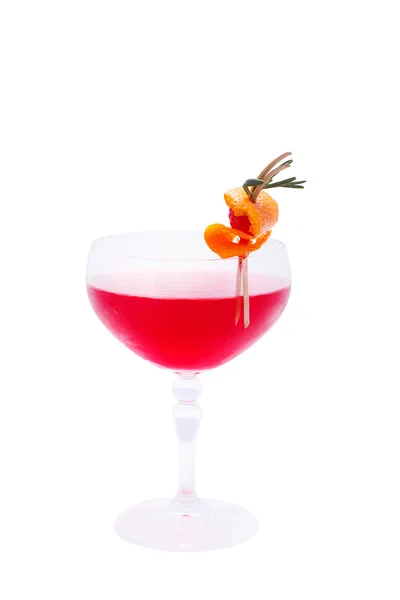 Red cocktail decorated with raspberries in orange skin — Stock Photo, Image