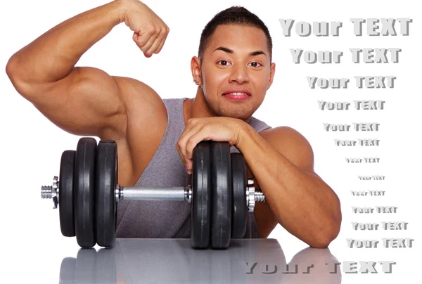 Confident guy posing in studio with big dumbbell — Stock Photo, Image