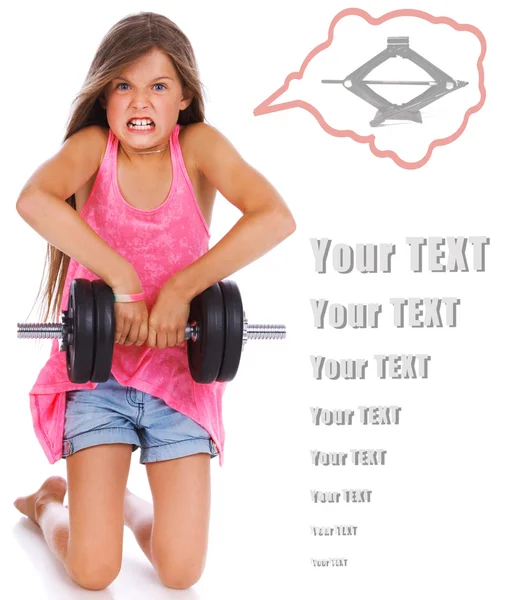 Little girl is fooling with a dumbbell — Stock Photo, Image