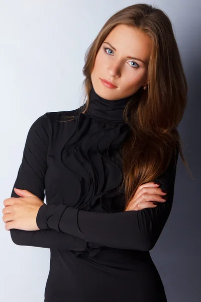 Young elegant woman in self confident pose — Stock Photo, Image