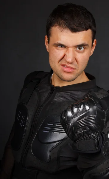 Motorcyclist is demonstrating his fist in a leather glove — Stock Photo, Image