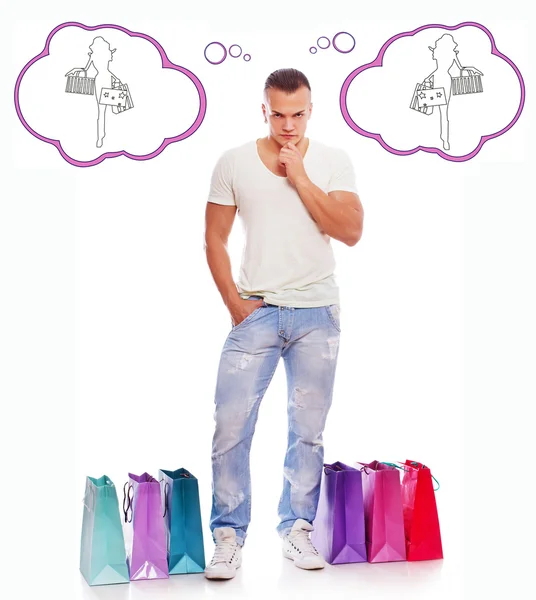 Attraente giovane uomo sta pensando di fare shopping — Foto Stock