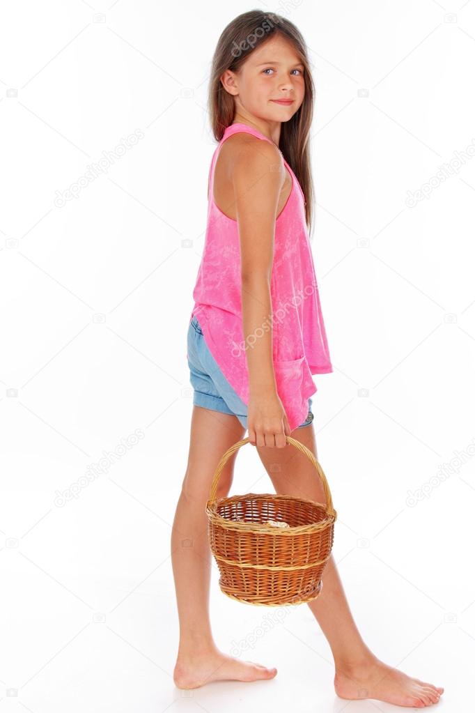 Girl is walking with basket