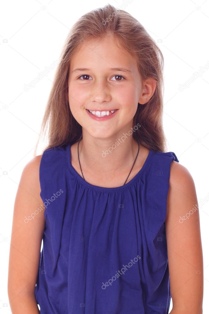 Portrait of shy smiling girl in blue dress