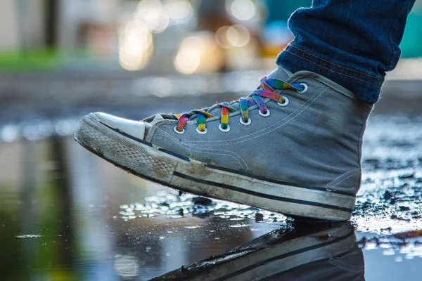 Funky plimsoll in making step on the road — Stock Photo, Image