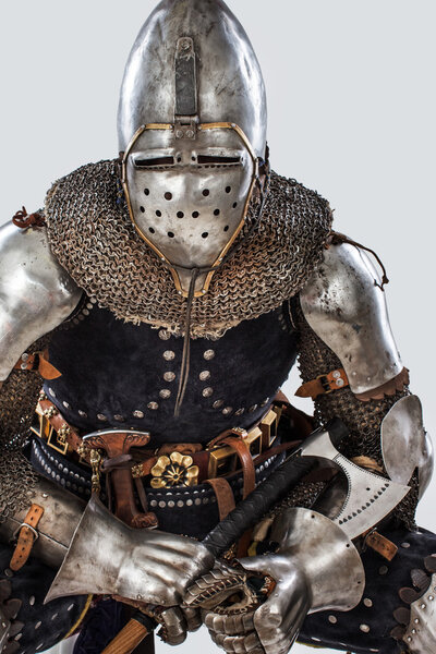 Image of sitting man in a knight costume