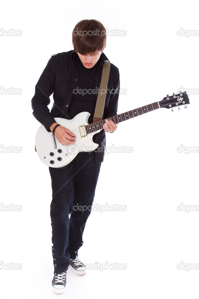 Teenage boy in dark clothing in playing on his white electric gu