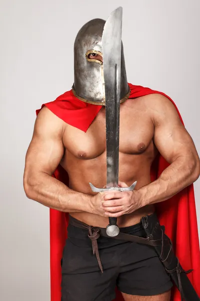 Hot musculed fighter with his sword — Stock Photo, Image