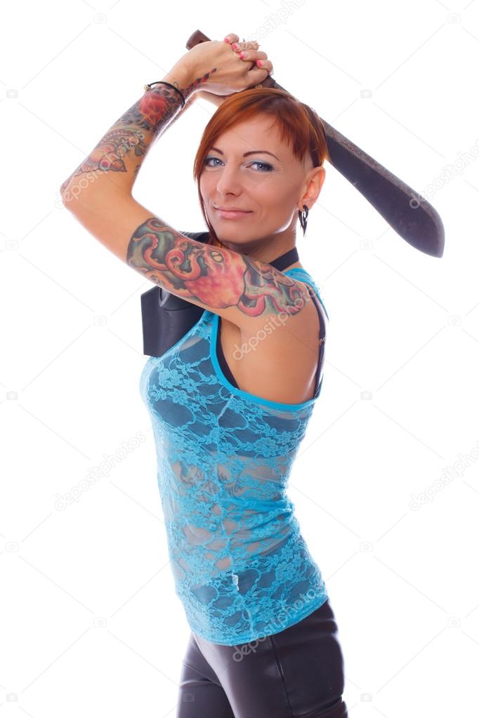 Young punk woman with machete in her hands