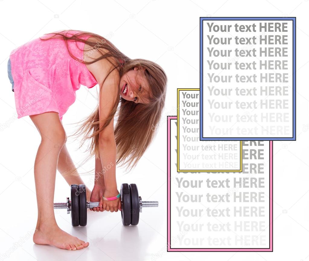 Little girl is fooling around with a heavy dumbbell