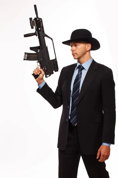 Armed professional killer on a white background — Stock Photo, Image