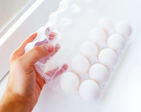 Package of eggs on a sill — Stock Photo, Image