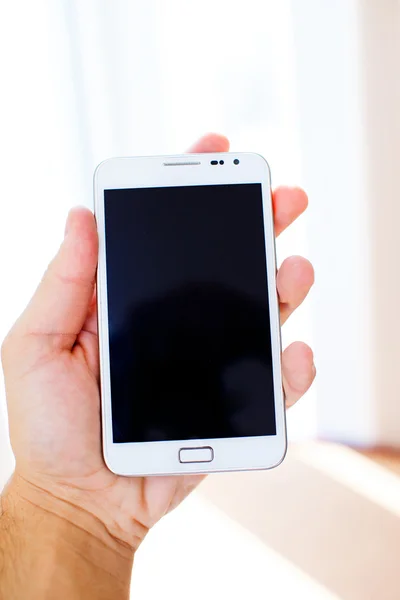 White galaxy s2 in male hand — Stock Photo, Image