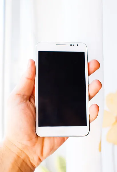 Male hand is holding white samsung galaxy s2 — Stock Photo, Image