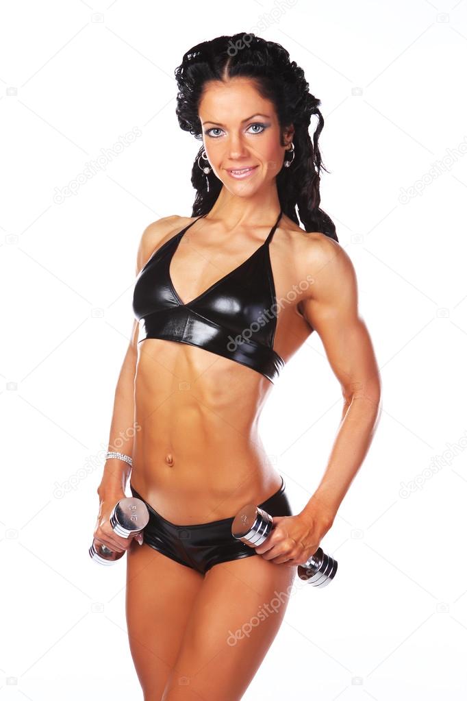 Woman in latex underwear and with dumbbells Stock Photo by