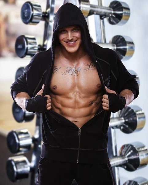 Image of muscle man who is demonstrating his abs