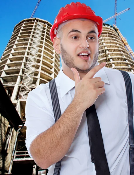 Businessman in front of construction — Stock Photo, Image