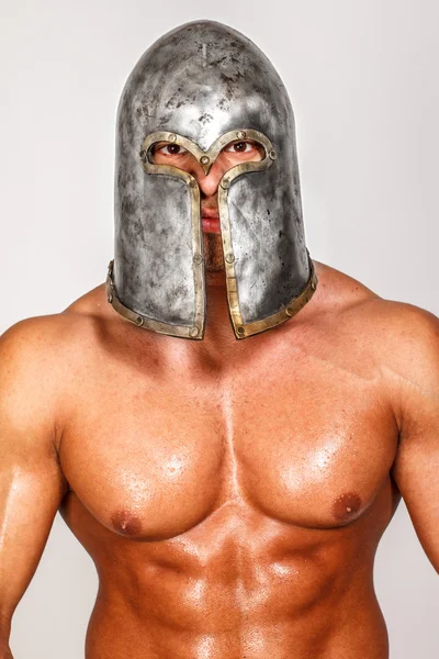 Portrait of shirtless warrior in helmet — Stock Photo, Image