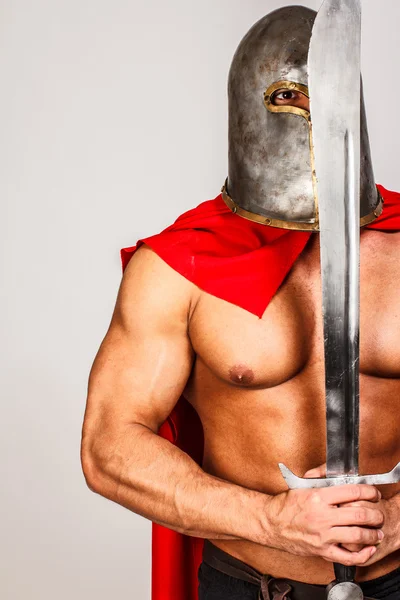 Calm warrior with a sword close to his face — Stock Photo, Image