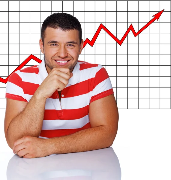 Usmívající se muž vpředu na nějaké rostoucí grafiku — Stock fotografie